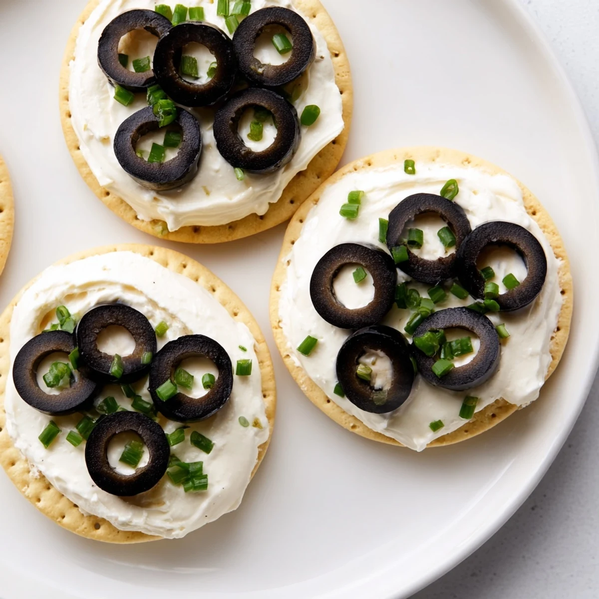 Creamy Gold Medal Olympic Ring Appetizers with colorful toppings arranged for a festive display.