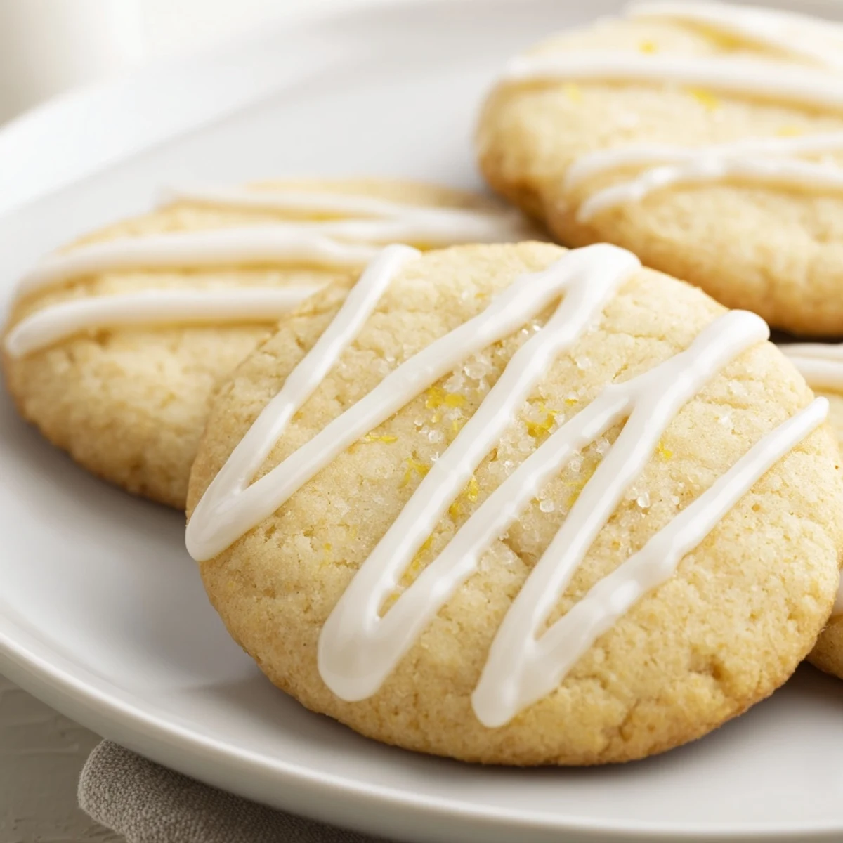 Golden holiday cookies with a delicate icing drizzle, perfect for festive sharing and enjoying at home.