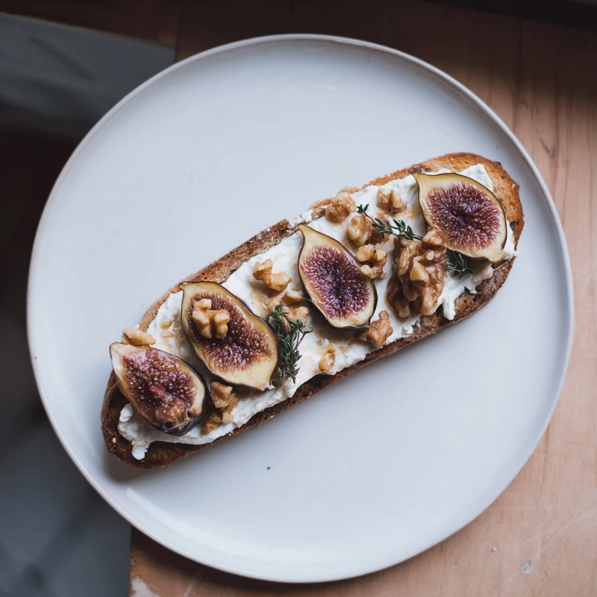 Royal Tapestry appetizer, a visually stunning arrangement of pâté, figs, cheese, and crunchy walnuts.