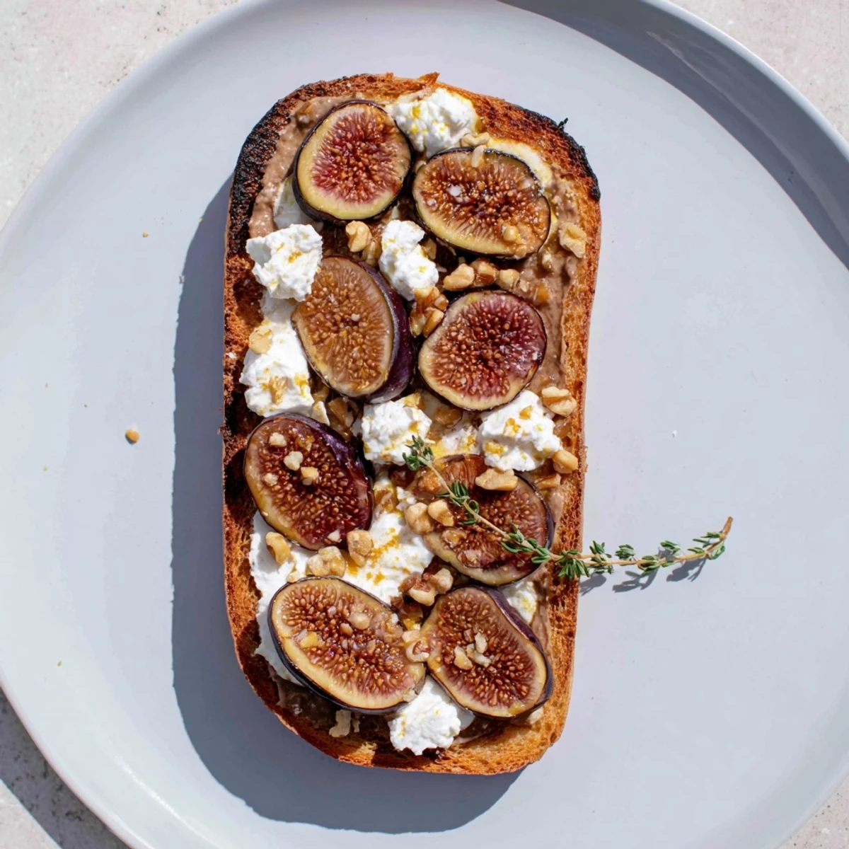 This vibrant Royal Tapestry appetizer features the beautiful contrast of pâté and sweet fig slices for serving.