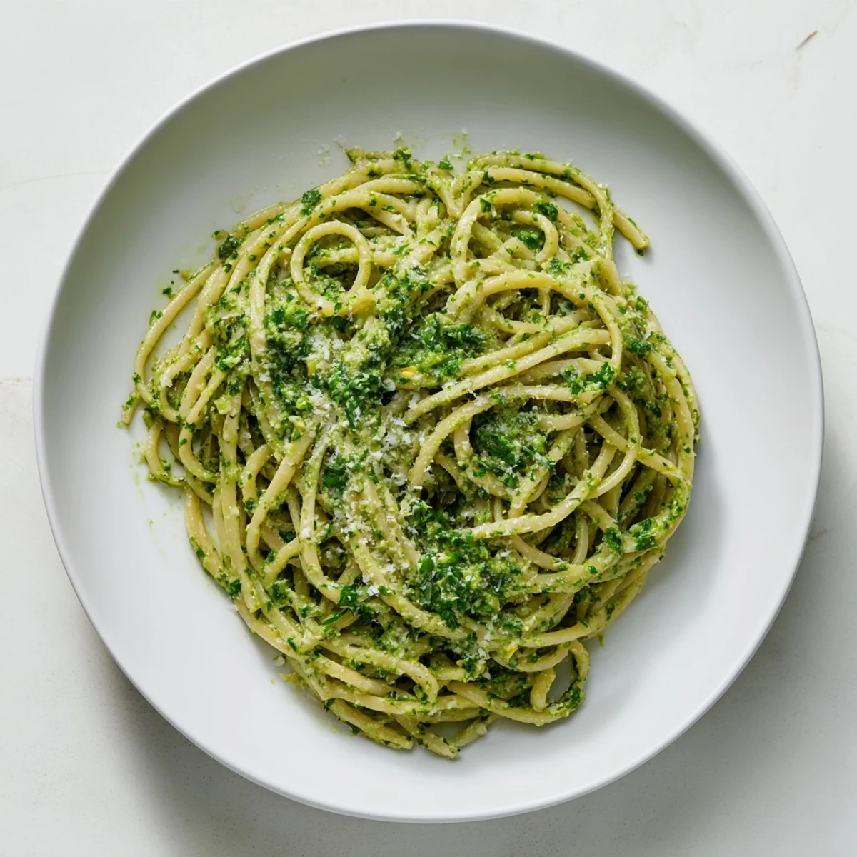 Fresh herbs create a bright green Green Goddess Pasta Sauce, perfectly coating al dente pasta.