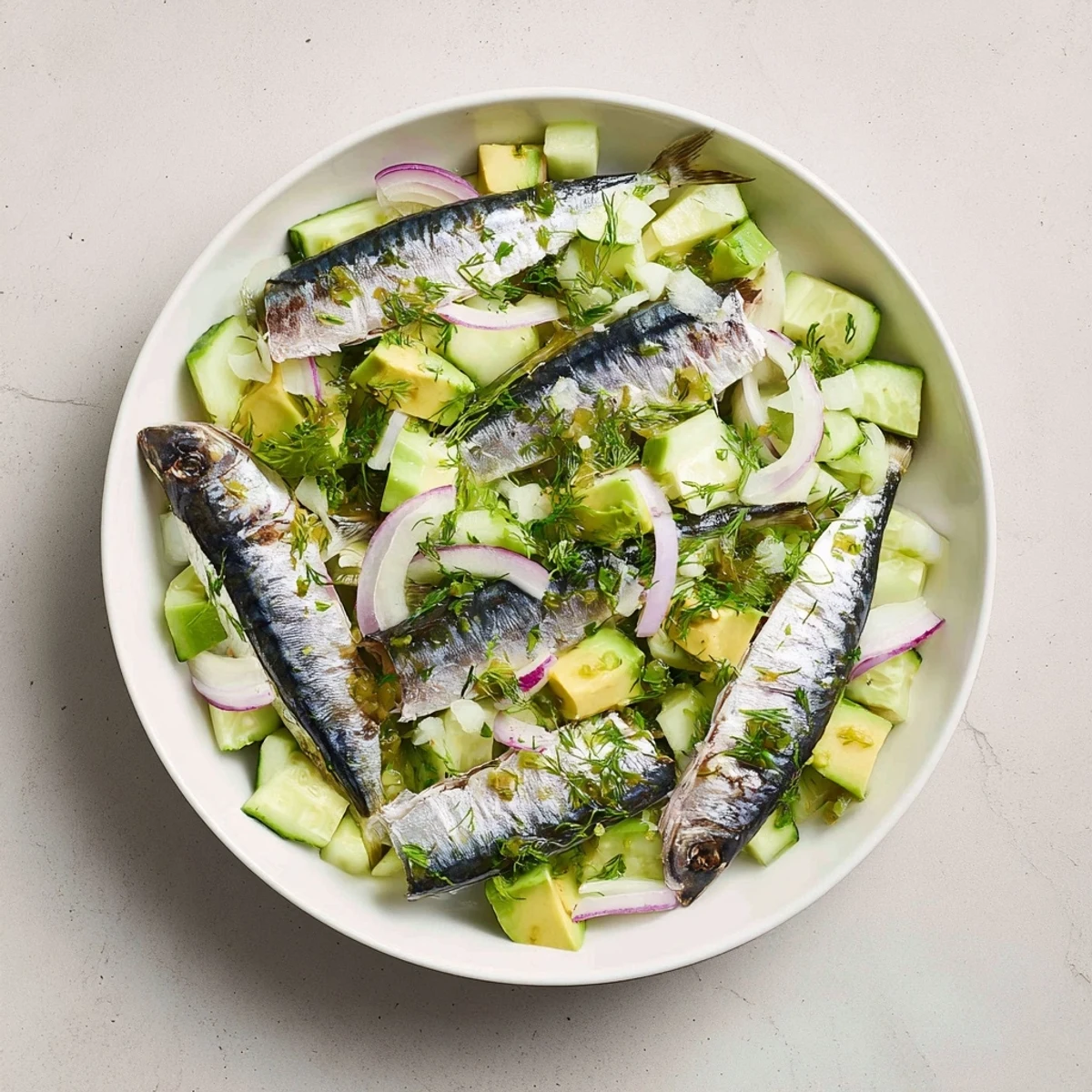 Refreshing cucumber and tinned fish salad: creamy avocado and tangy dressing make it a perfect date night meal.