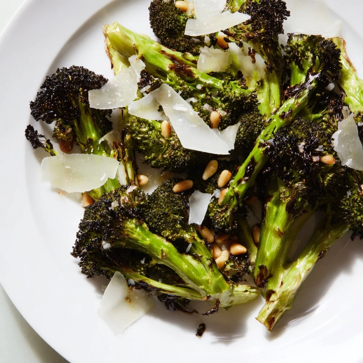 Smoky charred broccoli salad tossed in lemon dressing, topped with Parmesan for a vibrant side dish.