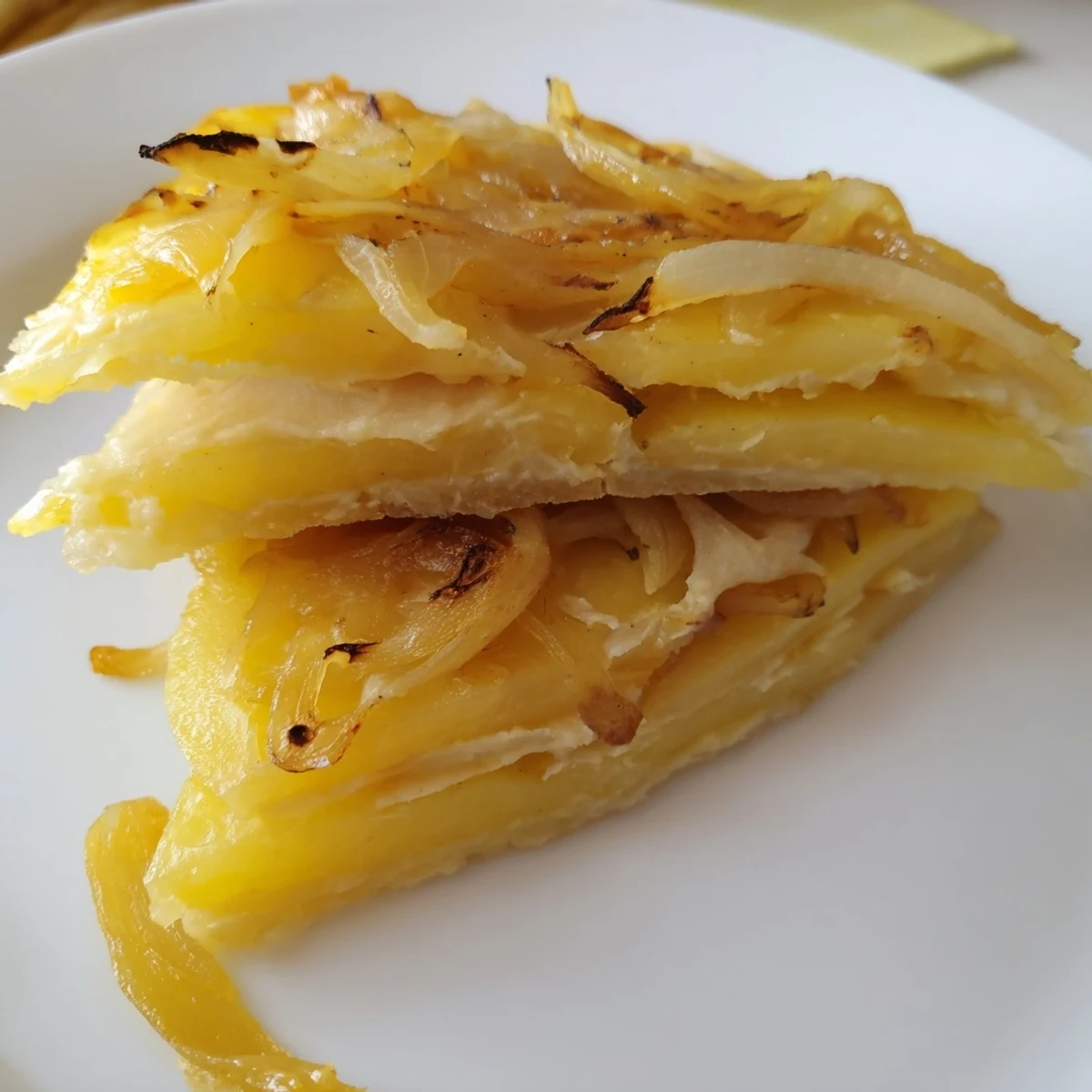 Golden, bubbly French Onion Soup Potatoes: a comforting side with melted Gruyère over caramelized onions.