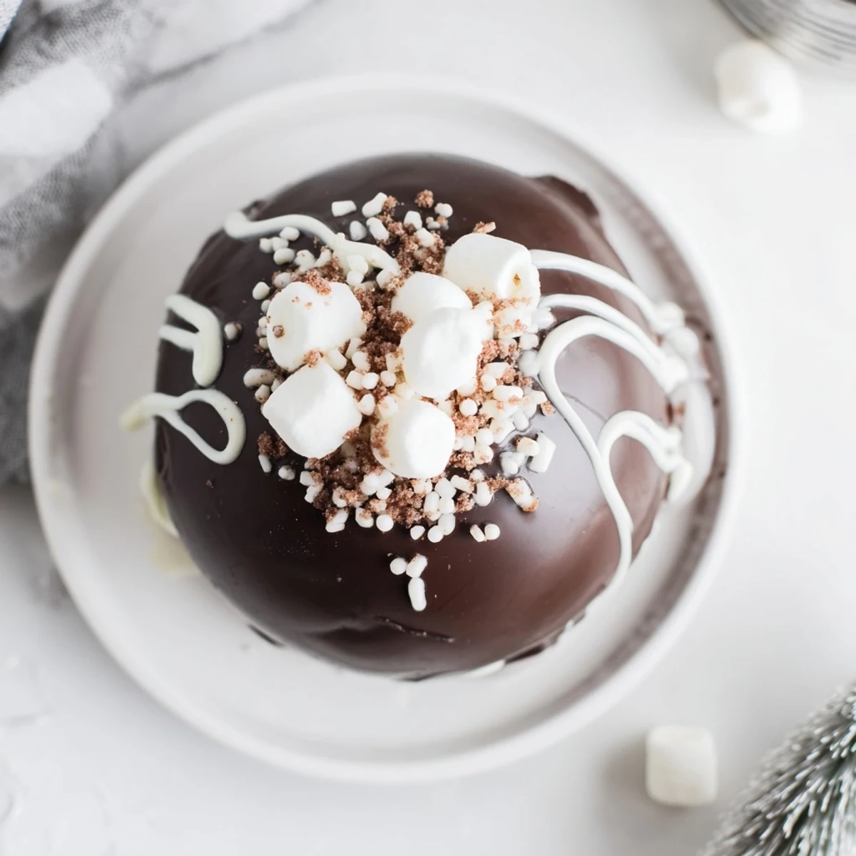 Six decadent Hot Chocolate Bombs arranged on a parchment-lined tray, each filled with mini marshmallows and cocoa powder, waiting to be stirred into hot milk.