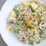 A close-up shot of the flavorful tuna noodle casserole 2.0 bubbling beneath a crispy parmesan topping.