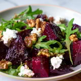 A close-up view of the fresh Roasted Beet Walnut Salad with creamy goat cheese and vinaigrette.