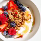 This Cottage Cheese Hot Honey Bowl presents a vibrant breakfast, mixing sweet berries, granola, and spicy honey.