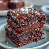 Rich sourdough discard brownies with a fudgy center and sea salt topping, baked to perfection for a decadent dessert.  