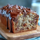 Wholesome banana bread packed with protein powder, ripe bananas, and melty dark chocolate chips for a guilt-free treat.  