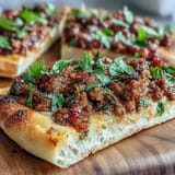 Beautifully baked Turkish Lahmacun pizza with spiced lamb and summery veggies.