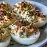 Tangy deviled eggs featuring sweet pickle relish, perfect picnic appetizers.