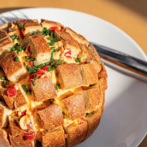 Golden, bubbly Pimento Cheese & Jalapeño Pull-Apart Grilled Cheese, perfect for sharing.