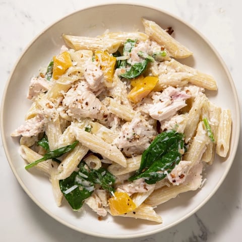 One-Pot Creamy Spinach & Turkey Christmas Pasta: a close-up showing creamy pasta with turkey and spinach.