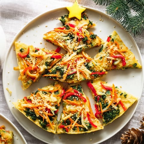 Festive Air Fryer Christmas Tree Veggie Tortilla Wraps showcase colorful veggies and cheese, crisped to golden perfection.