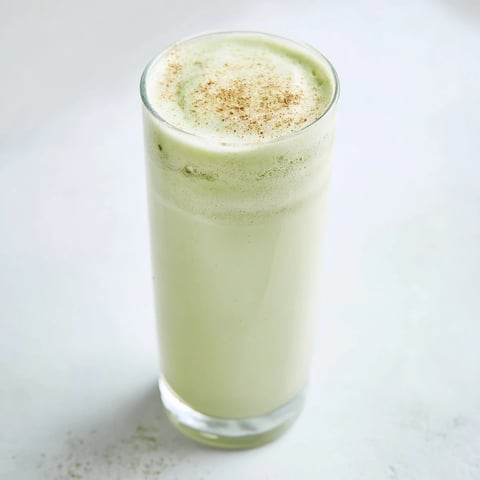 Matcha Eggnog Collagen Breakfast Smoothie swirled in a glass, ready for a nutritious, flavorful breakfast.