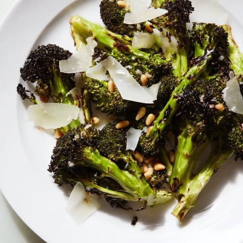 Smoky charred broccoli salad tossed in lemon dressing, topped with Parmesan for a vibrant side dish.
