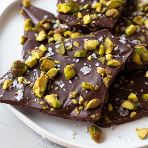 Golden caramel swirling over luscious dark chocolate bark, topped with crunchy pistachios.