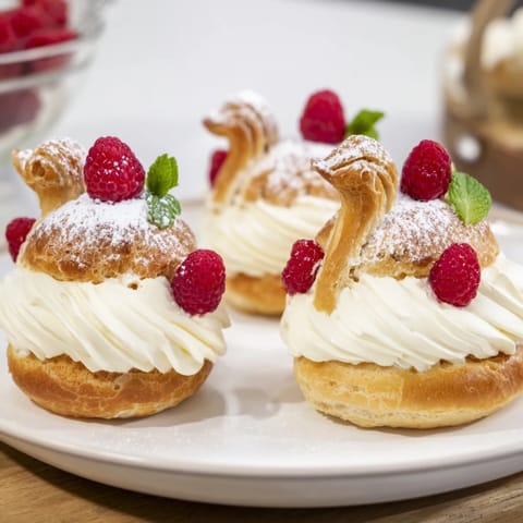 Delicate Plateau Cygne Pâtisseries Aériennes on a platter, ready for a fancy dessert serving.
