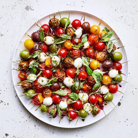 This colorful Appetizer Wreath features a delicious ring of olives and cherry tomatoes drizzled beautifully.