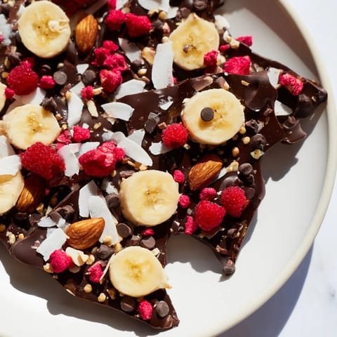 Close-up of freshly made Chocolate Banana Bark showcasing the sweet contrast of chocolate and bananas.