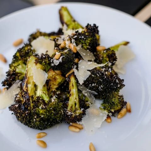 This delicious charred broccoli salad features roasted florets with toasted nuts, a zesty, bright flavor.