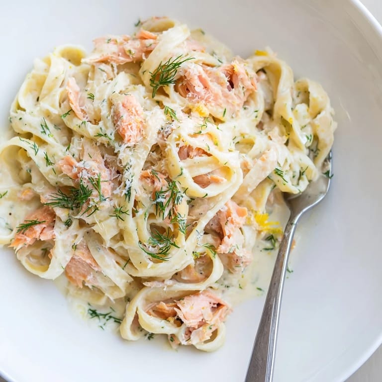 Silky, lemony creamy salmon pasta with flaked salmon in a rich sauce, ready to serve with crusty bread.