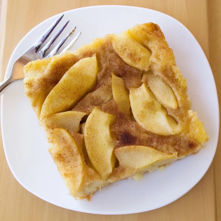 This golden Baked Apple Cake bakes to a moist, spiced finish, with tender apple slices and a sweet cinnamon sugar topping ideal for serving warm with coffee.