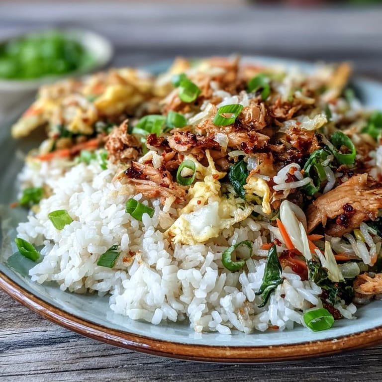 Tender chicken, crisp cabbage, and scrambled eggs stir-fried into savory Egg Roll Fried Rice.